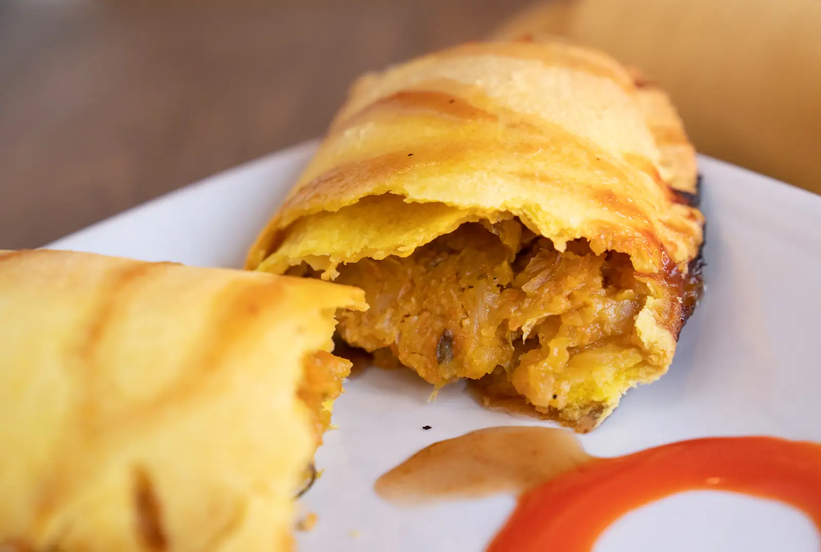 Veggie patty, flaky pastry with spiced cabbage and carrot