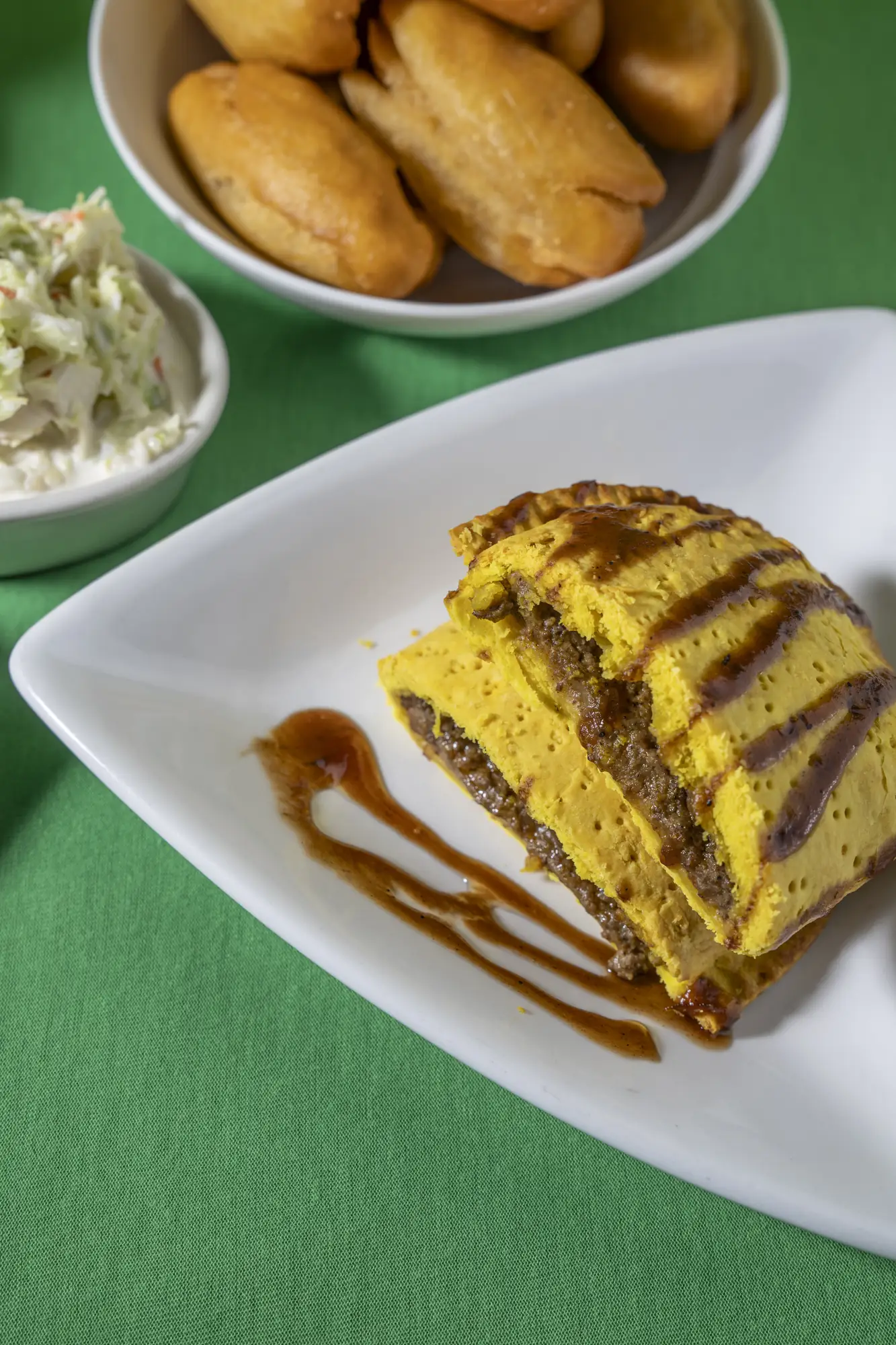 Jamaican beef patty with coleslaw and festival