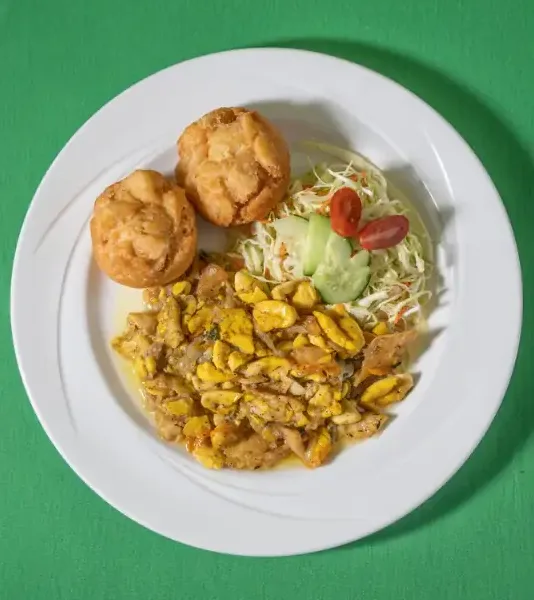 Ackee and saltfish with johnny cakes and salad