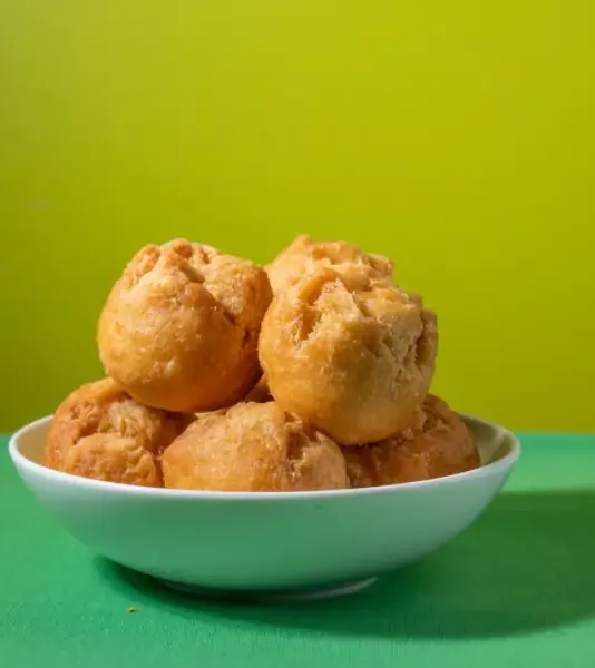 A bowl of golden festival dumplings