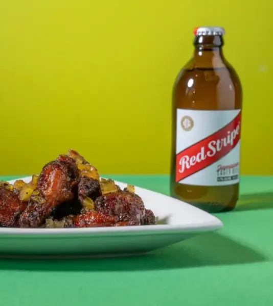 Jerk chicken wings with a Red Stripe beer