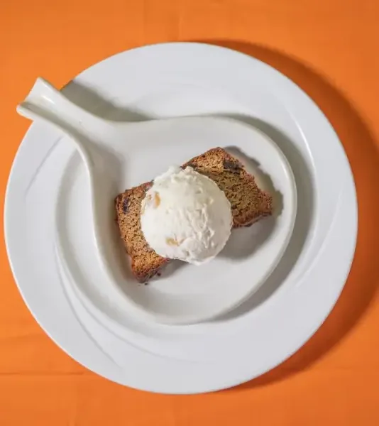 Rum cake with a scoop of vanilla ice cream